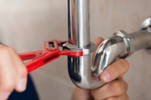 Plumber Fixing Pipe